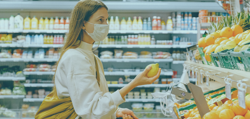 woman shopping at grocery store with mask
