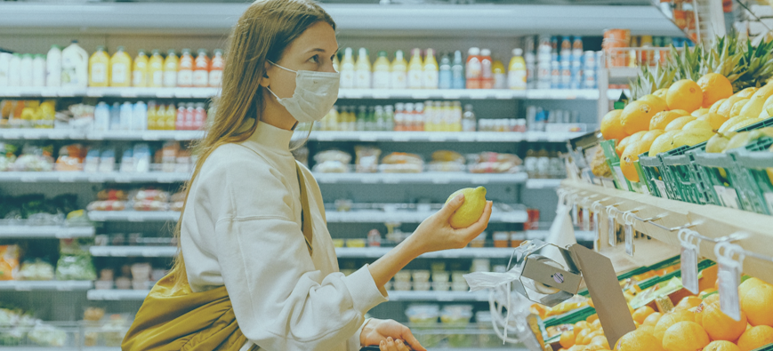 woman shopping at grocery store with mask