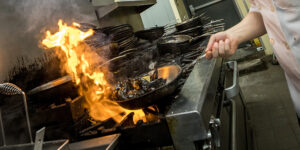 Chef cooking over stove