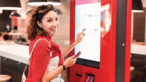 Customer Using Automated Kiosk