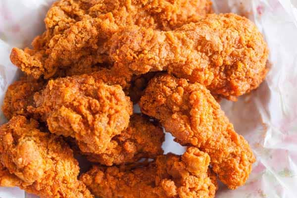 6 pieces of fried chicken on a platter