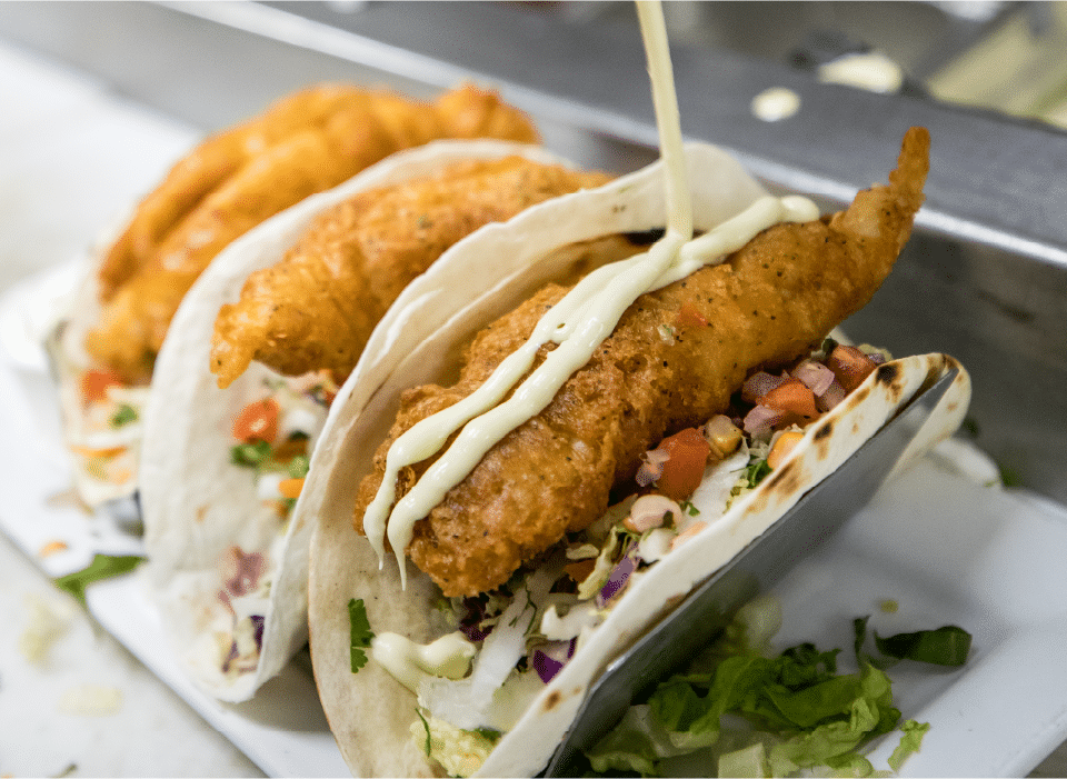 Fresh tacos made with a cooking oil management system.