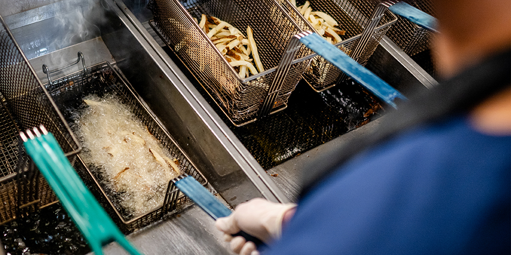 Employee frying food