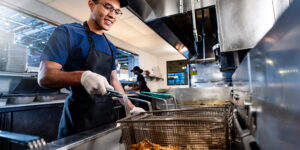 Worker at fryer