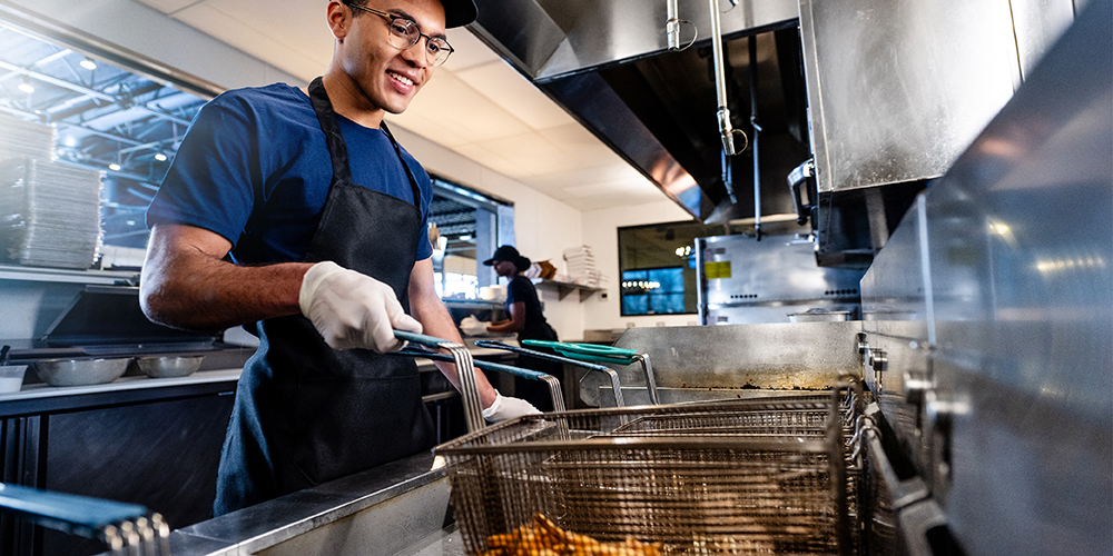 Worker at fryer